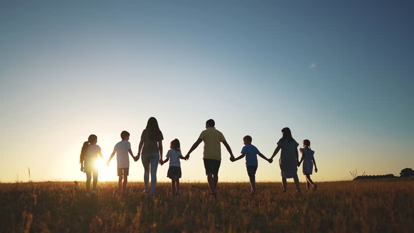 big family. huge community family holding hands walking in the park sunset. happy family kid dream concept. big family community walking with children sunlight in the park. friendly people walking Royalty-Free Stock Footage #1109741935