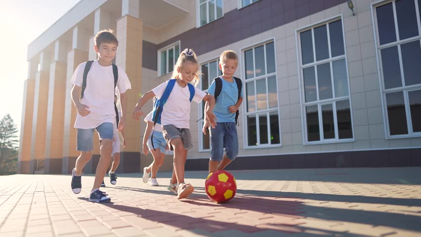 children near the school playing soccer. kids a school education kid dream concept. a group of children near the school playing ball. group of school children playing soccer lifestyle Royalty-Free Stock Footage #1109741951