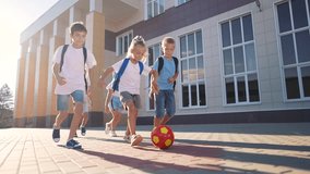children near the school playing soccer. kids a school education kid dream concept. a group of children near the school playing ball. group of school children playing soccer lifestyle - Powered by Shutterstock - Get 15% off with code: PIKWIZARD15