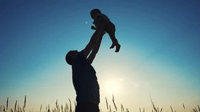 father throws play baby in park. father's day silhouette happy family child dream concept. father plays with baby throws up. dad play his son in nature in the park silhouette at sunset lifestyle - Powered by Shutterstock - Get 15% off with code: PIKWIZARD15