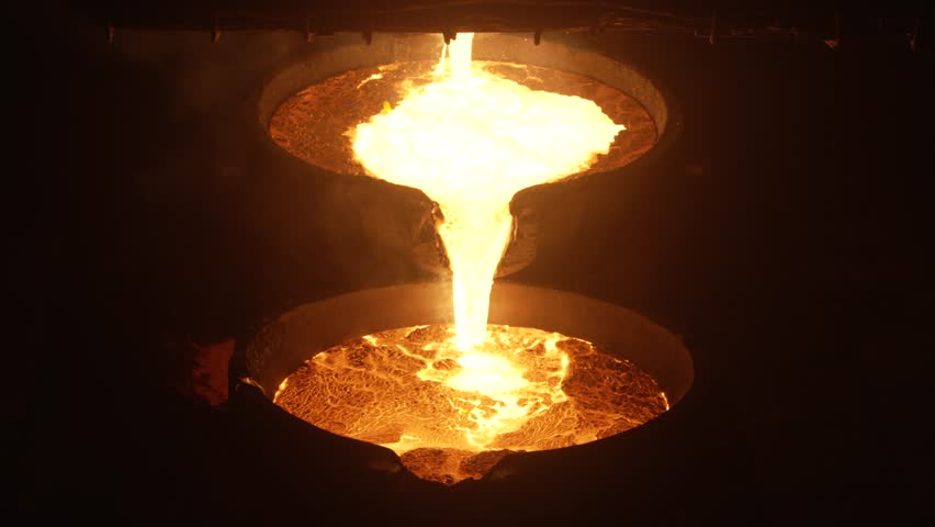 A closeup shot of metal smelting and molding process