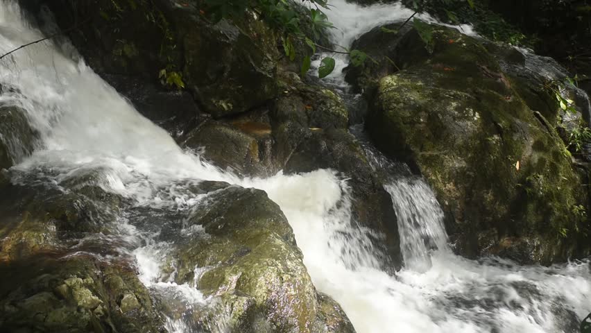 water falling on river pass rock and stone at north Chet Kod waterfall in Thailand 