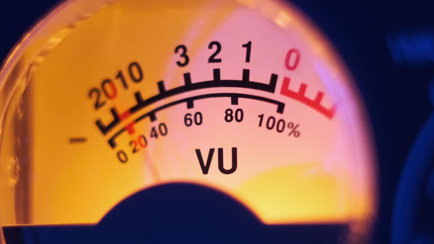 Analog round arrow indicator of audio signal level with yellow backlight. Close-up of classic retro VU meter. Old equipment, music playback or recording. Sound dB decibels of volume on tape recorder Royalty-Free Stock Footage #1109751853
