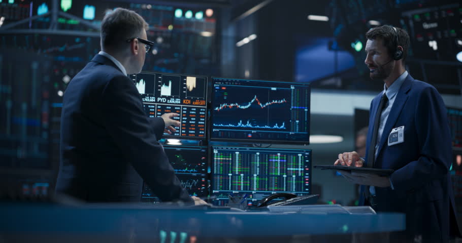 Two Successful Traders Analyzing Real-Time Financial Data and Reports About the State of the Finance Market. Stock Exchange Professionals Discussing Buy and Sell Options For Different Bonds Royalty-Free Stock Footage #1109752803