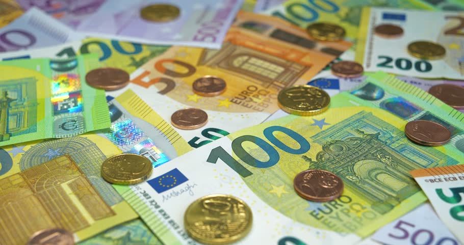 Real euro banknotes and metal coins of various colors, size and nominals. Banknotes 500, 200, 100 and 50 Euro and Euro cents of various denominations Royalty-Free Stock Footage #1109757881