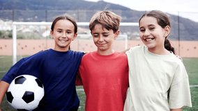 Child friends after soccer training having fun at football pitch - Childhood and sport life style concept - Powered by Shutterstock - Get 15% off with code: PIKWIZARD15