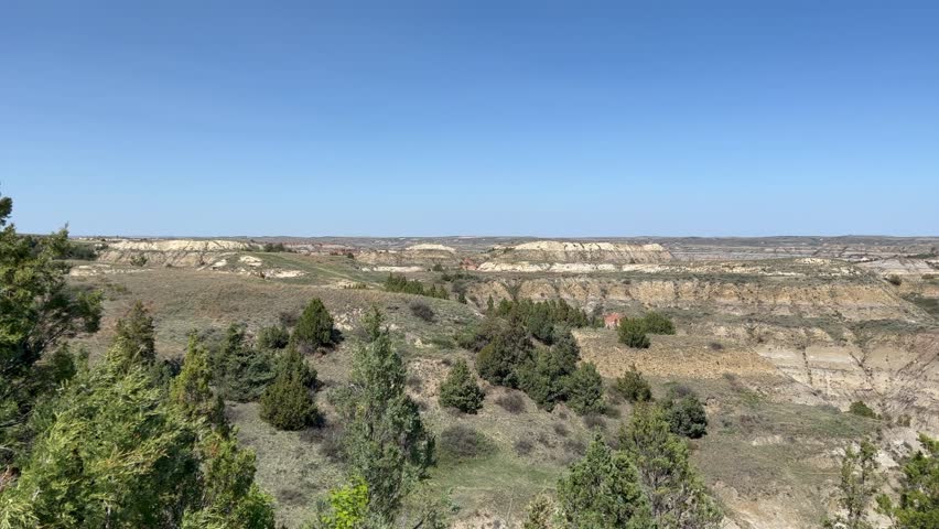 Panning left on  the  badlands hills and mountains in Theodore Roosevelt National Park in North Dakota.