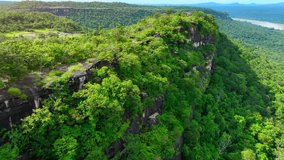 Pha Taem, seen from a drone, showcases ancient rock formations, revealing geological history through stratigraphy and erosion patterns. Pha Taem National Park, Thailand. Travel Wonders concept.
