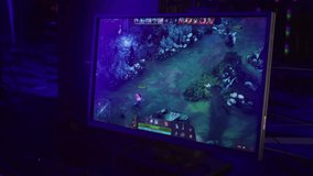 Warrior Character Attacks Enemy Monster In Computer Game. Online Esports Tournament. Competitive Tournament Computer Game. Heroes Casting Magic Spells In MOBA Computer Game Tournament