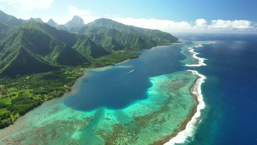 Aerial Tahiti. surfing in Teahupoo. Exotic tropical island, ocean, mountains. Drone  French Polynesia. Teahupoo is a famous surfing destination near Papeete. Adventure travel.  Royalty-Free Stock Footage #1109767875