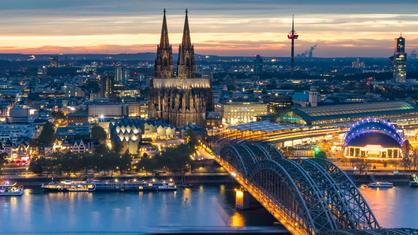 Cologne skyline aerial view time lapse from da to night, koln germany city view from above beutiful sunset over cologne cathedral in old town. Cologne bridge and dome.