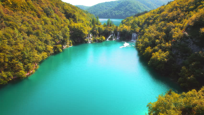 Mountain landscape with waterfalls and lake in autumn forest in Plitvice Lakes National Park Croatia.