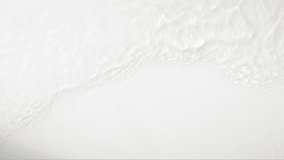 Pure beige water with reflections sunlight in slow motion. Water surface texture top view. Sun and shadows. Motion clean swimming pool ripples and wave, 4k. - Powered by Shutterstock - Get 15% off with code: PIKWIZARD15