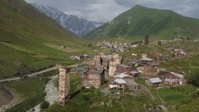 The ancient medieval Svan towers in the village of Ushguli, Georgia, North Svaneti. Sights of Georgia. Arial View of Svanetia, summer natural landscape, nature of Georgia.  4k ultrahd arial video