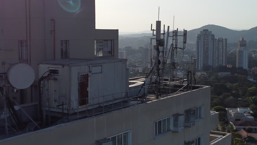 Flying By Communication Antenna On Top Of a Building