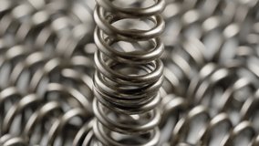 Close-up of Spinning Coil Spring Device - Metal Spring. - macro - Powered by Shutterstock - Get 15% off with code: PIKWIZARD15