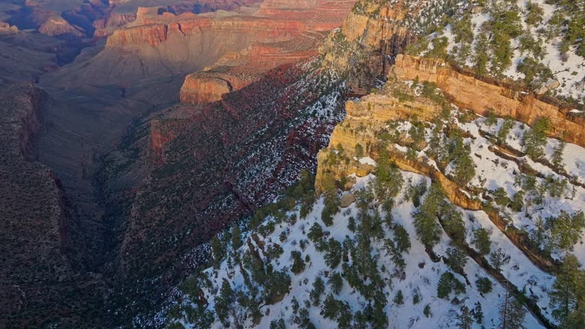 Snow Covered Landscape Of The Grand Canyon In Arizona, USA - aerial shot