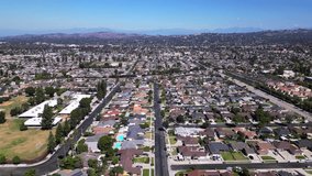 Flying over a neighborhood with lots of middle class houses in Southern California. - Powered by Shutterstock - Get 15% off with code: PIKWIZARD15