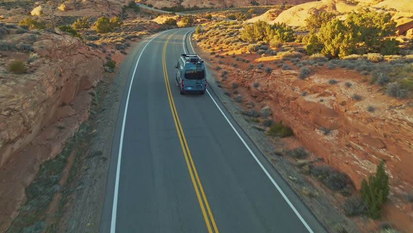Paved Road Of The Scenic Arches Drive During Sunset In Utah, United States. Aerial Shot
