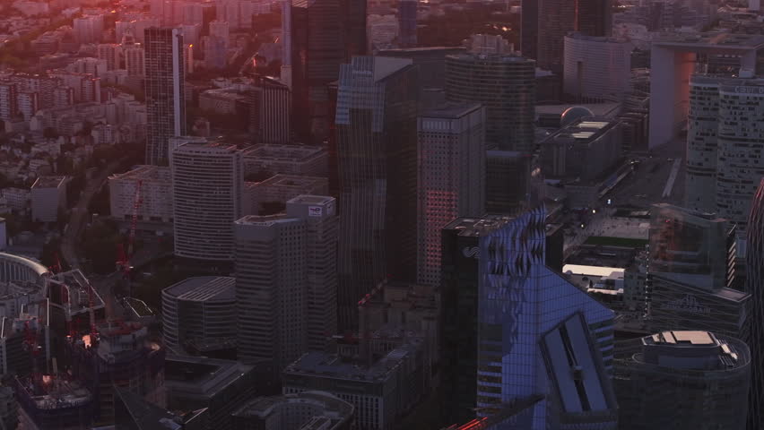 Aerial slide and pan shot of skyscrapers in La Defense district. Futuristic business urban borough at sunset. Paris, France Royalty-Free Stock Footage #1109775597