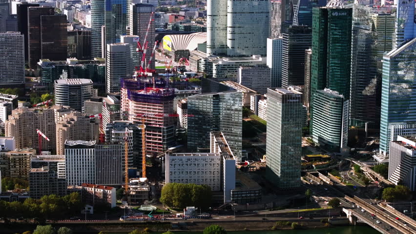 Various modern high rise buildings in financial hub. Cranes on construction site of new skyscraper. Futuristic business district La Defense. Paris, France Royalty-Free Stock Footage #1109775609
