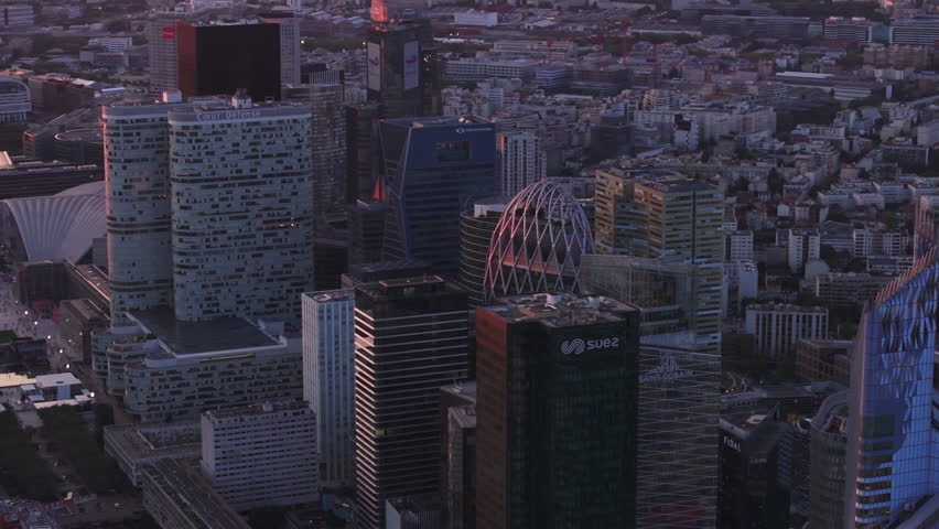 Aerial slide and pan footage of futuristic buildings in modern business district at dusk. Financial center in La Defense. Paris, France Royalty-Free Stock Footage #1109775709