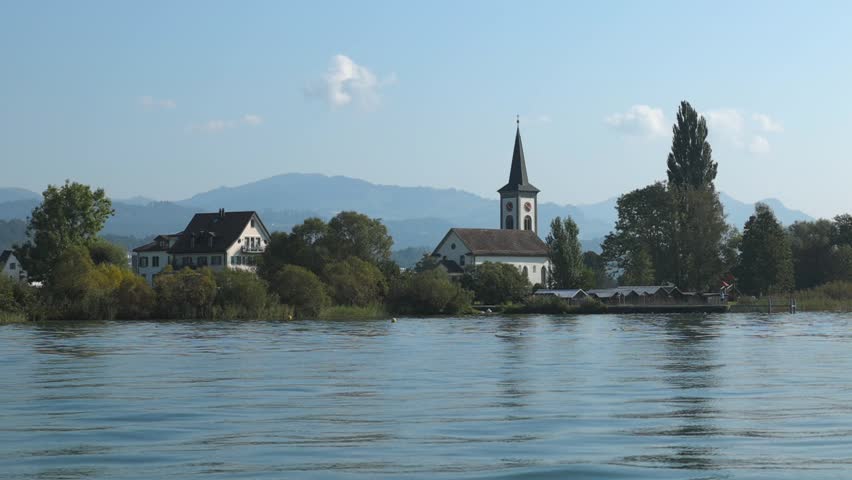 old lakeside church in Switzerland, lakeside religious building