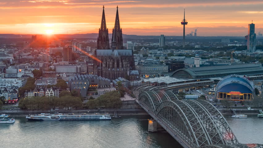 Cologne skyline aerial view time lapse from da to night, koln germany city view from above beutiful sunset over cologne cathedral in old town. Cologne bridge and dome.