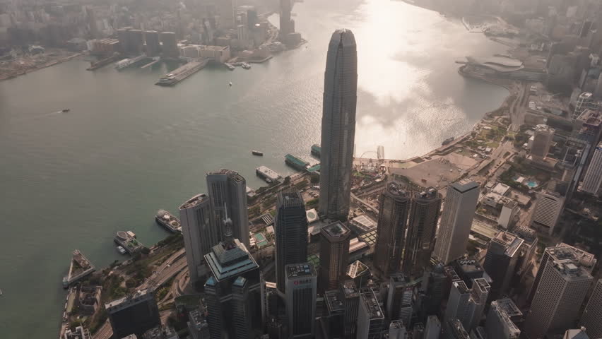 Drone view of Hong Kong cityscape at night at Victoria Harbour, drone aerial top view. Asia travel destination ,business finance and economy concept