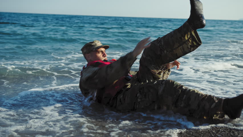 Military man performs crunches with touch of the feet