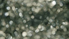 The Magic of the Holidays. 4K Slow-Motion Footage of Festive Foil Tinsel in Close-up. The Essence of Holiday Joy and Celebration. Glimmering Strand Radiates the Magic and Warmth of Family Gatherings - Powered by Shutterstock - Get 15% off with code: PIKWIZARD15