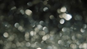 The Magic of the Holidays. 4K Slow-Motion Footage of Festive Foil Tinsel in Close-up. The Essence of Holiday Joy and Celebration. Glimmering Strand Radiates the Magic and Warmth of Family Gatherings - Powered by Shutterstock - Get 15% off with code: PIKWIZARD15