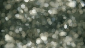 The Magic of the Holidays. 4K Slow-Motion Footage of Festive Foil Tinsel in Close-up. The Essence of Holiday Joy and Celebration. Glimmering Strand Radiates the Magic and Warmth of Family Gatherings - Powered by Shutterstock - Get 15% off with code: PIKWIZARD15