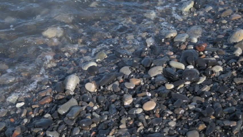 Waves crashing on the pebble beach.