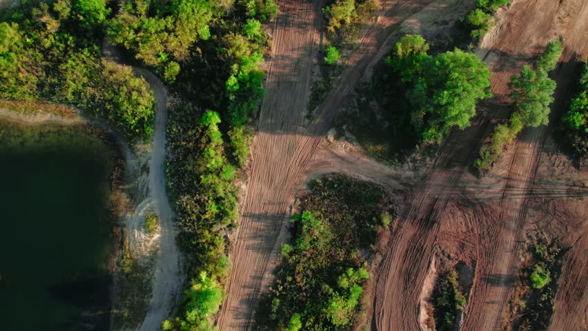 top down aerial of motorcross riders driving off road on dirt bikes tracks. Rocky Glen OHV Park Rockford Illinois USA