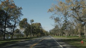 POV View from the window of a car that drives through a typical American suburb in the state of New York. 4k video