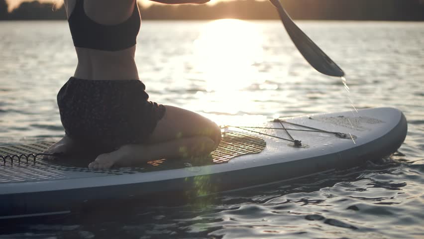 Stand Up Paddle Boarding. Warm Summer Beach Vacation Holiday. Travel Paddles Paddleboard. Sup Board Journey. Young Woman Relaxing On Sup Surf Swimming. Watersport Floating On Sup Surfboard At Sunset Royalty-Free Stock Footage #1109809443