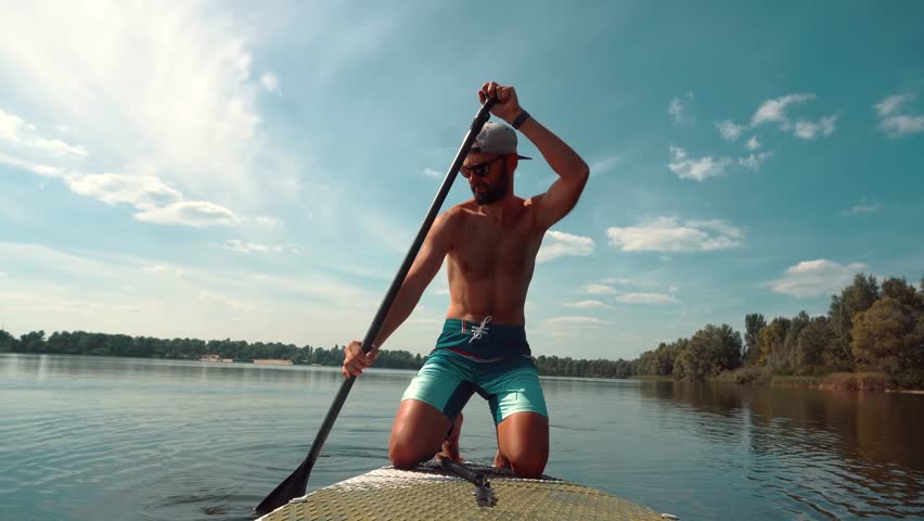 Paddleboarder Sport Sup Surfing. Recreation Paddling Sup Surfboard. Inflatable Board Rowing. Surfer Recreation Sport Watersport Activity.Travelling Water Tourism.Raft SUP. Paddler Surfing Exploration Royalty-Free Stock Footage #1109809835
