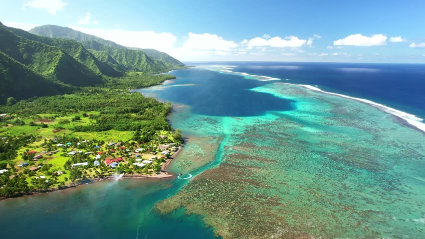 Drone Tahiti. Aerial view of lagoon. Exotic tropical island, ocean, mountains. Aerial view of French Polynesia. Teahupoo is a famous surfing destination. Adventure travel.  Royalty-Free Stock Footage #1109815281