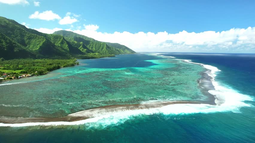 Drone Tahiti. tropical island lagoon, coastal mountains. Aerial view of French Polynesia. Teahupoo is a famous surfing destination near Papeete. Adventure travel.  Royalty-Free Stock Footage #1109815315