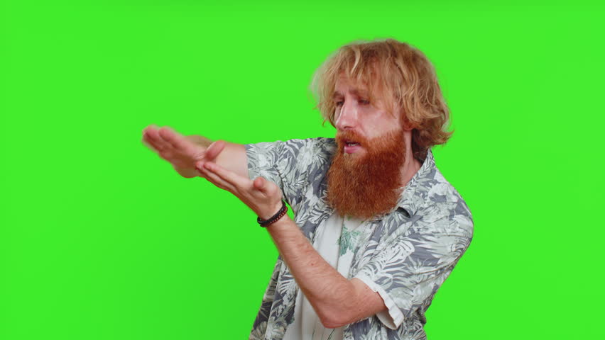 Young man showing wasting throwing sharing money around, more tips, big profit, winning lottery jackpot, successful shopping payment purchase cashback. Redhead guy isolated on chroma key background