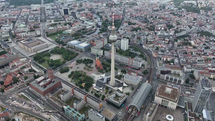 City of Berlin, Germany from above.Aerial view of cityscape showing architectural landmarks Fernsehturm TV Tower and Berlin Cathedral by day. Drone Flight over Alexanderplatz TV Tower, Sunflairs circa