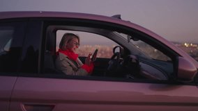 Female millennial get good news on mobile phone while sits in car interior. Young woman beaming with joy,  celebrating goal achievement after receiving an approved application with email confirmation - Powered by Shutterstock - Get 15% off with code: PIKWIZARD15