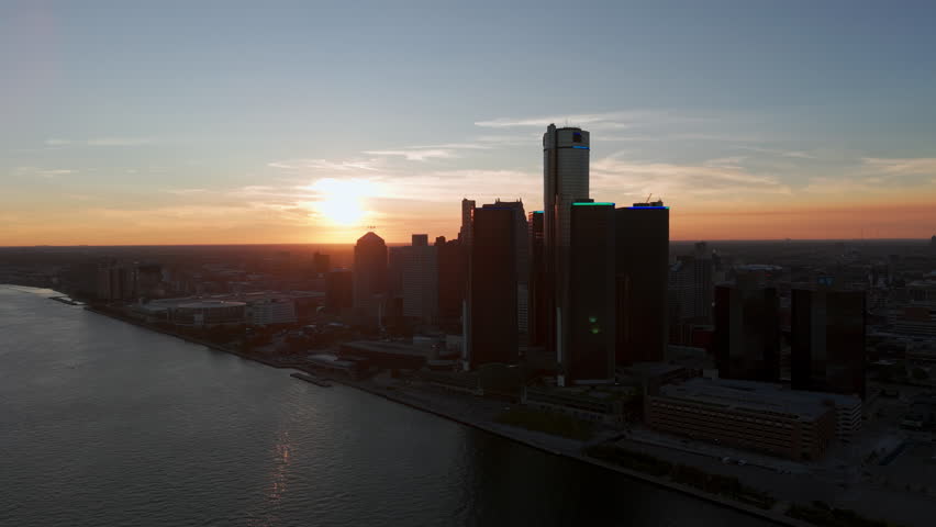Panoramic aerial shot of the city of Detroit. Central Business District and Detroit river on sunset Time. Aerial view. 