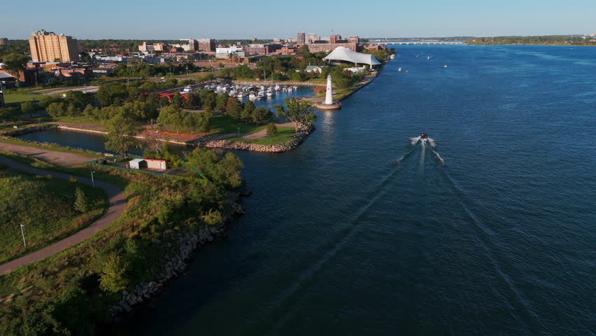 Detroit Michigan Aerial wide shot of panoramic cityscape from near Milliken Park Lighthouse with river and downtown skyline 