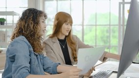 Collaboration of graphic design business people with computer in an office company. Two corporate women in creative marketing team working on project management, Designer teamwork, web design  - Powered by Shutterstock - Get 15% off with code: PIKWIZARD15