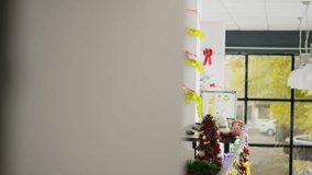 Employee in Christmas decorated office happy to show management positive company profit during videocall. Worker in teleconference meeting talking with managers during xmas holiday season - Powered by Shutterstock - Get 15% off with code: PIKWIZARD15