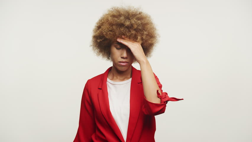 Woman In Despair Looking At Camera on White Background
