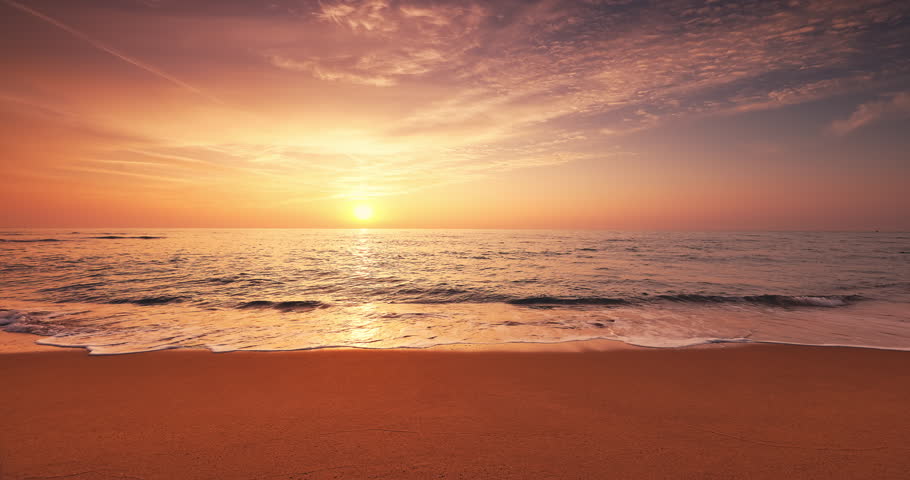 Beautiful sunrise over the sea waves and sandy beach shore, tropical paradise island video