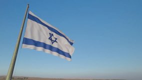 The Israeli flag found against a cloudless blue sky in northern Israel on the Golan Heights